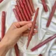 رژلب میس رز دو طرفه در دست